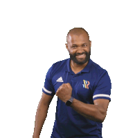 a man wearing a blue adidas polo shirt is smiling