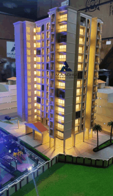 a model of a building with the word maadhu on the top