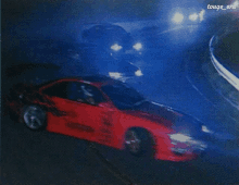 a red car is driving down a road with the words touge era on the bottom right