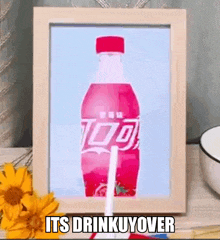 a framed picture of a coca cola bottle with a straw and the words its drinkuyover