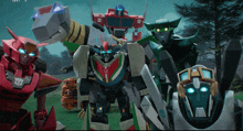 a group of transformers standing next to each other with the word transformers on the bottom right