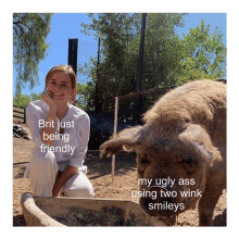 a woman kneeling next to a pig with the caption brit just being friendly