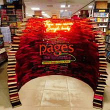 a bookstore with a sign that says pages the bookshop