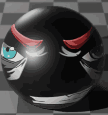 a black ball with angry eyes and red horns