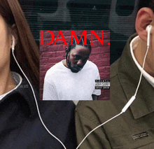 a man wearing ear buds is listening to damn album