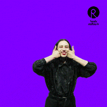 a woman in a black shirt is making a funny face in front of a purple background with the word rozbark on it