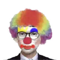 a man in a suit and tie is dressed as a clown with glasses and a colorful wig .