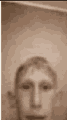 a close up of a man 's face in a sepia tone .