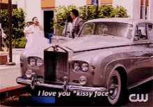 a silver car with the words i love you kissy face on the side