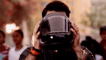 a man wearing a helmet covering his face