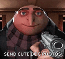 a despicable me character is holding a gun in his hand .