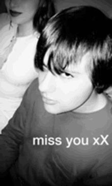 a black and white photo of a boy and a woman with the words miss you xx on the bottom