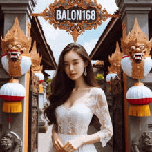 a woman in a white dress stands in front of a sign that says balon 168