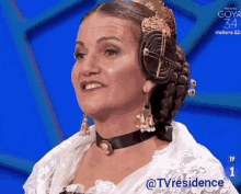 a woman is wearing a choker and earrings and says tvresidence on the bottom