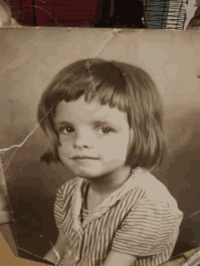 a black and white photo of a little girl