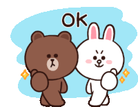 a brown bear and a white rabbit are standing next to each other with the word ok written above them