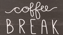 a sign that says coffee break in cursive