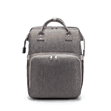 a gray diaper bag with a gold zipper