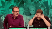 two men are sitting in front of a screen that says " james corden "