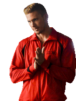 a man wearing a red jacket with the word zero on the front