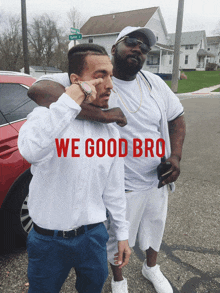 two men standing next to each other with the words " we good bro " on the front