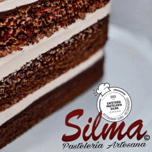 a close up of a cake with the words silma pasteleria artesana