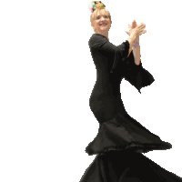 a woman in a black dress is dancing with a shadow behind her