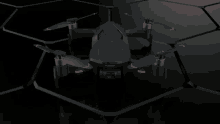 a futuristic looking drone is sitting on top of a dark surface