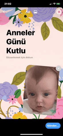 a phone screen shows a picture of a baby and the words " anneler gunu kutlu "