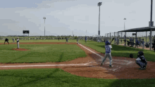 a baseball game is being played and the batter is wearing a jersey that says ' a ' on it