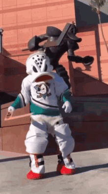 a mascot for the mighty ducks is dancing