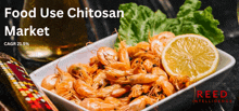 a plate of shrimp with lemon slices and lettuce with the words food use chitosan market above it