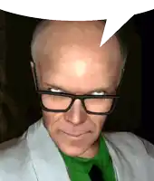 a man wearing glasses and a green shirt has a white speech bubble above his head