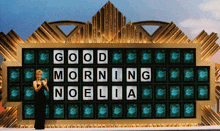 a woman stands in front of a board that reads good morning noelia