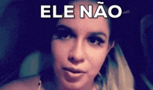 a close up of a woman 's face with the words ele nao in white letters