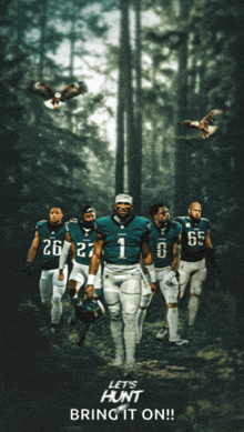 a group of eagles players are walking through a forest