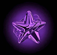 a purple star is surrounded by purple wires on a purple background