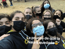 a group of girls wearing face masks with the words la prueba de que la naia a quedado on the bottom