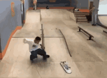 a person is riding a skateboard on a ramp in a skate park .