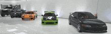 a green car with a skull and crossbones on the front is next to a black car