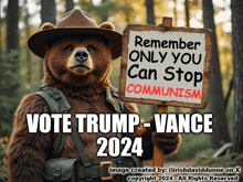 a teddy bear is holding a sign that says remember only you can stop communism