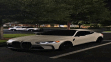 a white car is parked in a parking lot next to a white police car