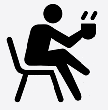 a silhouette of a man sitting in a chair with a cup of coffee