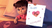 a little girl is holding up a piece of paper that says accepter moi