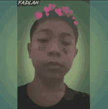 a young man with hearts on his head and the name fadlan on the bottom right