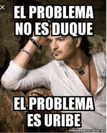 a meme of a man sitting on a couch with el problema no es duque el problema es uribe