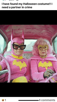 two women in pink batman costumes are sitting in a car