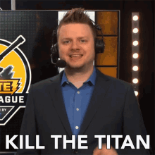 a man wearing a suit and headphones says " kill the titan "