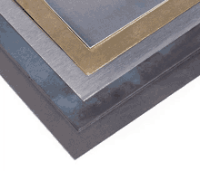 a stack of metal sheets of different sizes and colors