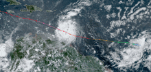 a satellite image of a hurricane with a red line showing the path